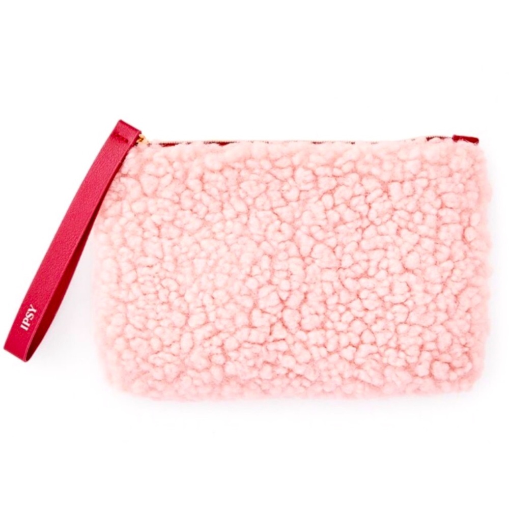 Fuzzy‎ pink makeup bag with maroon zipper pull and inner lining
IPSY